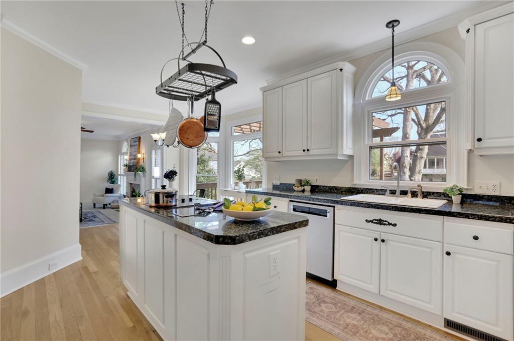 2430 Stonevalley Lane Cumming, GA 30041 - Photo 23 of 45 a kitchen with granite countertop a sink a stove and cabinets