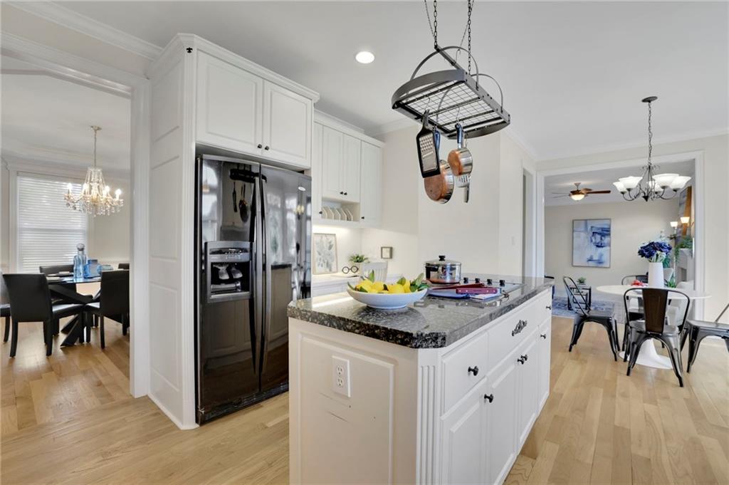 2430 Stonevalley Lane Cumming, GA 30041 - Photo 24 of 45 a kitchen with a refrigerator and a dining table