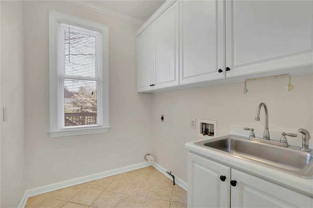 2430 Stonevalley Lane Cumming, GA 30041 - Photo 25 of 45 a bathroom with a sink and cabinets
