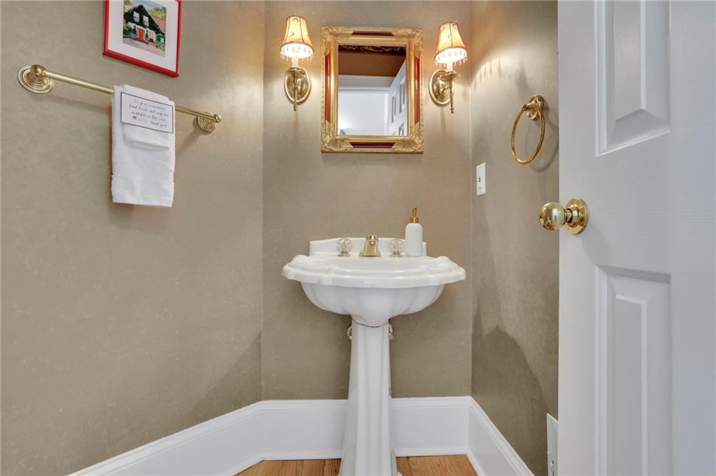 2430 Stonevalley Lane Cumming, GA 30041 - Photo 26 of 45 a bathroom with a sink and a mirror