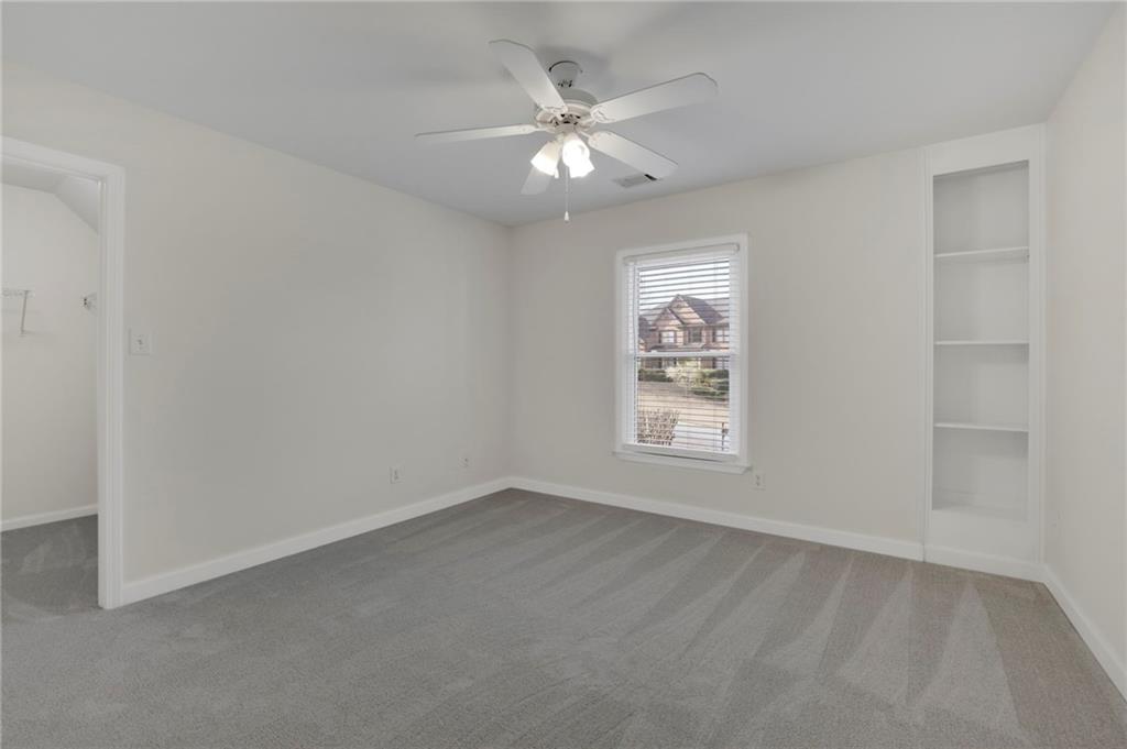 2430 Stonevalley Lane Cumming, GA 30041 - Photo 28 of 45 wooden floor in an empty room with a window