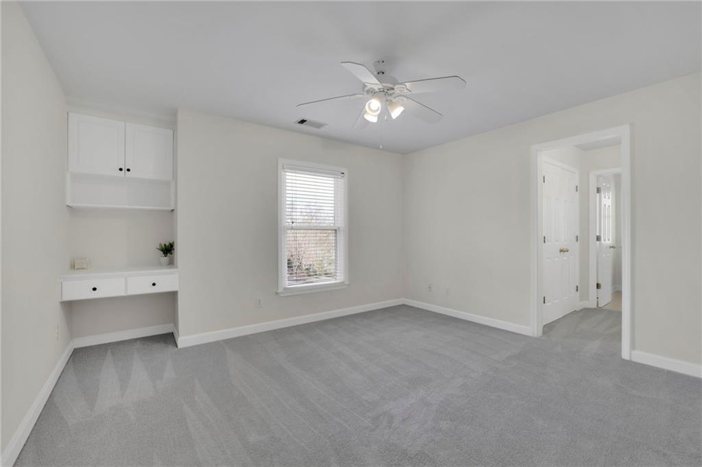 2430 Stonevalley Lane Cumming, GA 30041 - Photo 32 of 45 a view of an empty room with a window