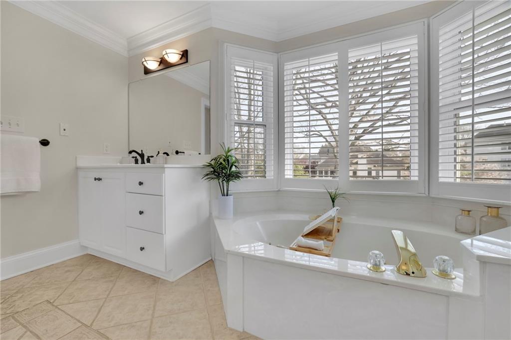 2430 Stonevalley Lane Cumming, GA 30041 - Photo 37 of 45 a living room with furniture and a large window