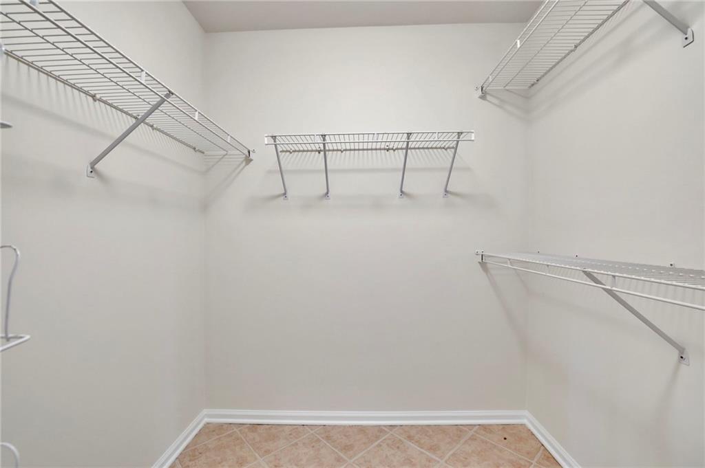 2430 Stonevalley Lane Cumming, GA 30041 - Photo 38 of 45 a view of an empty walk in closet
