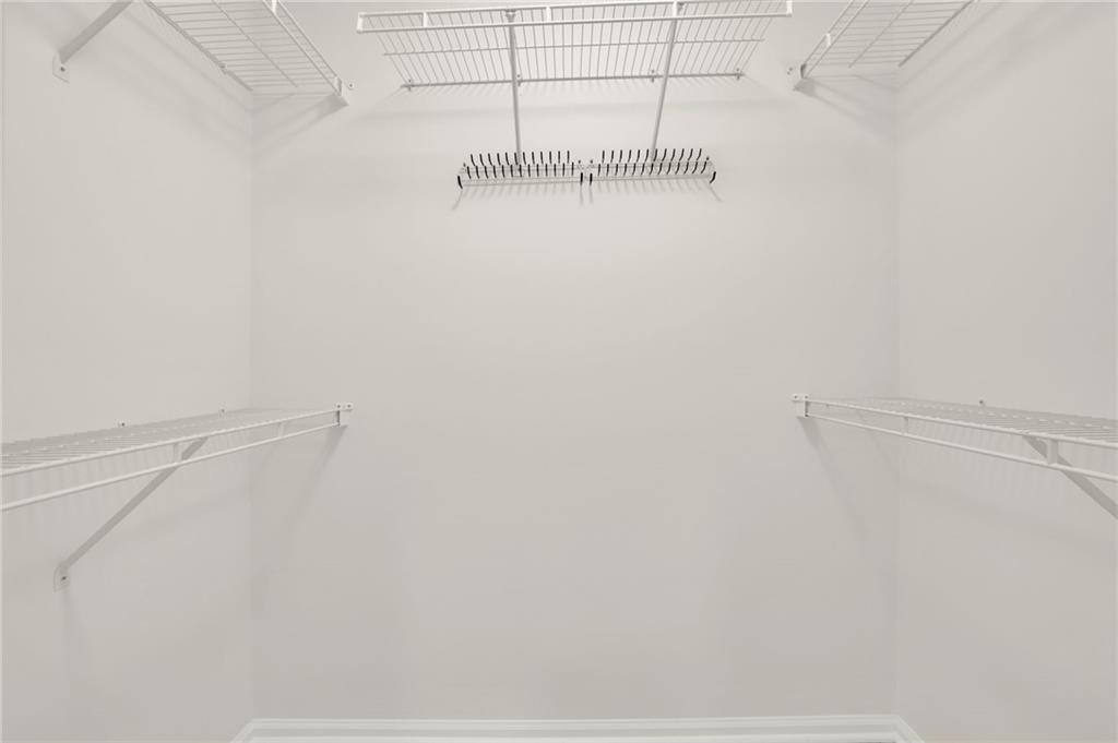 2430 Stonevalley Lane Cumming, GA 30041 - Photo 39 of 45 a view of small space with racks on the wall