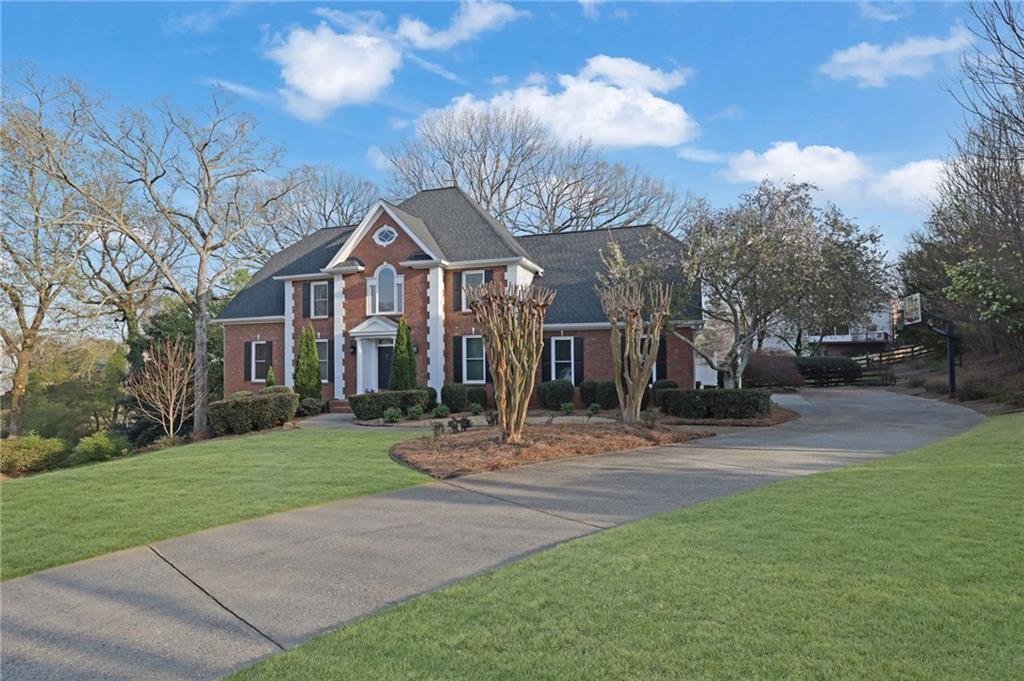 2430 Stonevalley Lane Cumming, GA 30041 - Photo 4 of 45 a front view of house with yard and green space