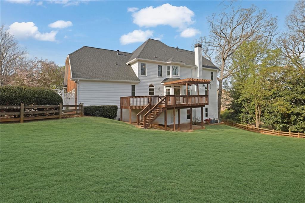 2430 Stonevalley Lane Cumming, GA 30041 - Photo 43 of 45 a view of a house with a yard