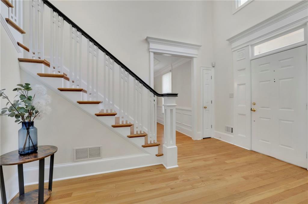 2430 Stonevalley Lane Cumming, GA 30041 - Photo 9 of 45 a view of entryway with wooden floor and front door