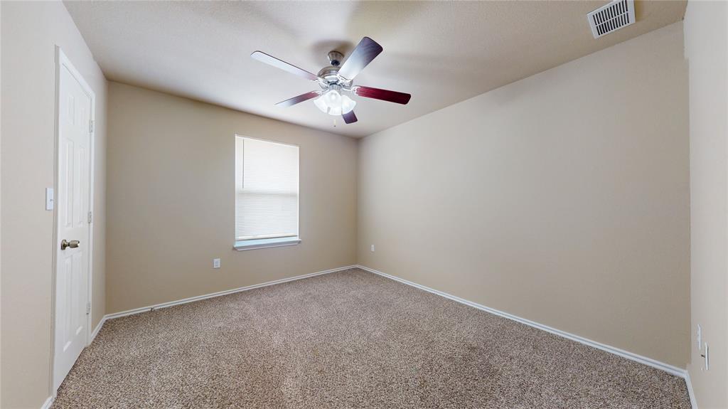812 Parkplace Ridge Princeton, TX 75407 - Photo 11 of 17 Carpeted spare room featuring ceiling fan and baseboards
