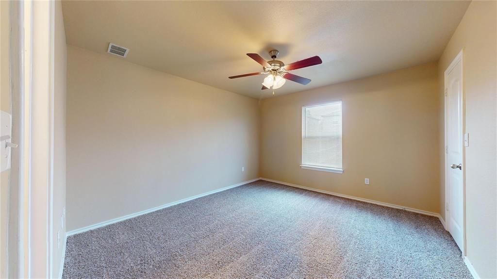 812 Parkplace Ridge Princeton, TX 75407 - Photo 12 of 13 Carpeted empty room featuring baseboards and ceiling fan