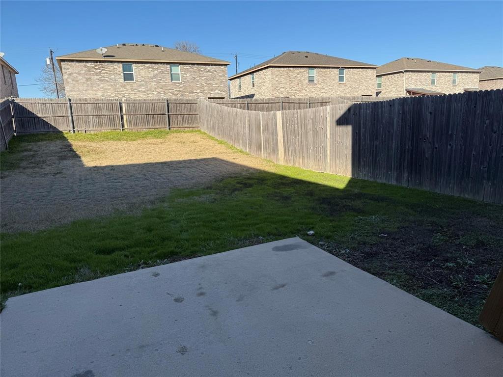 812 Parkplace Ridge Princeton, TX 75407 - Photo 13 of 13 Fenced backyard with a patio area and a residential view