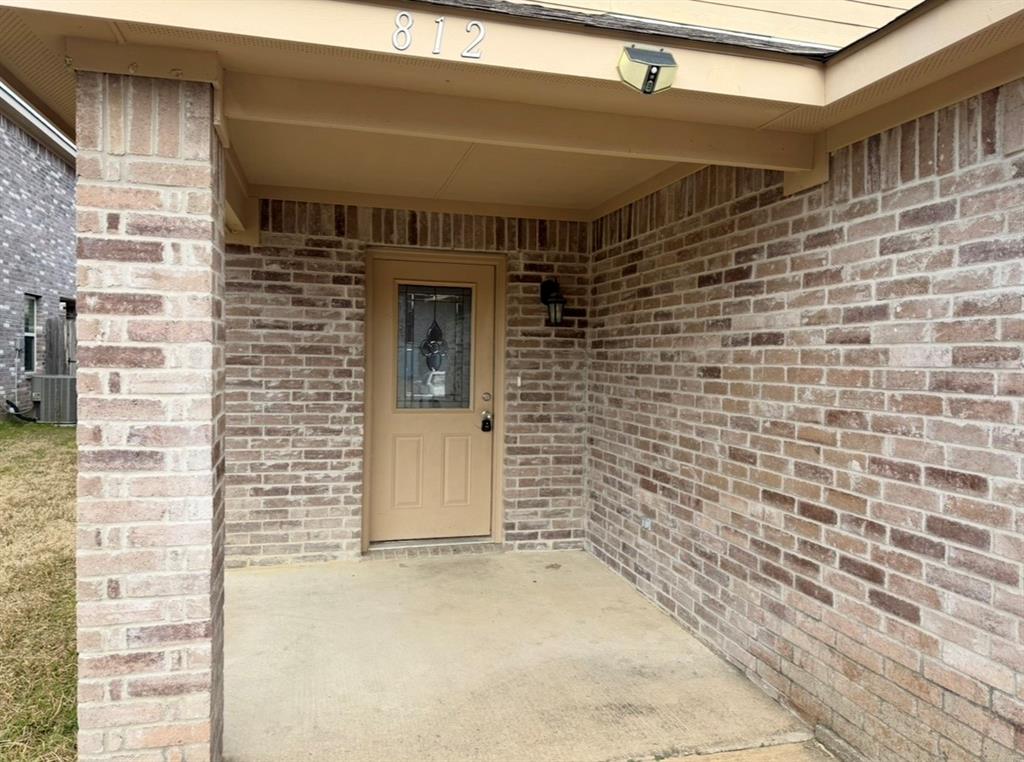 812 Parkplace Ridge Princeton, TX 75407 - Photo 2 of 17 Doorway to property with brick siding