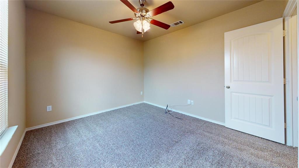 812 Parkplace Ridge Princeton, TX 75407 - Photo 6 of 13 Carpeted empty room featuring baseboards and a ceiling fan