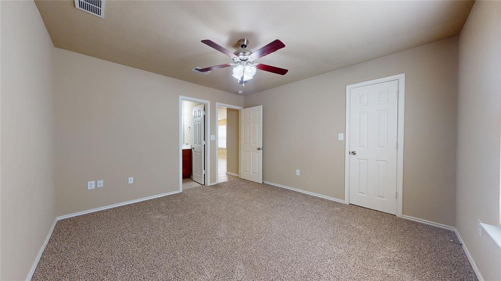 812 Parkplace Ridge Princeton, TX 75407 - Photo 9 of 17 Unfurnished bedroom featuring carpet, a ceiling fan, and ensuite bathroom