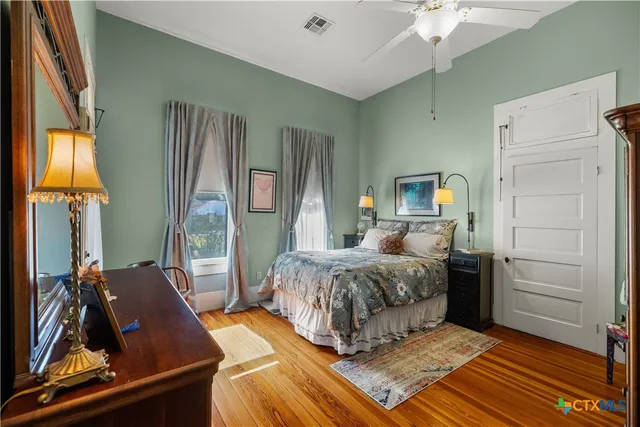 a bed room with a bed and a window