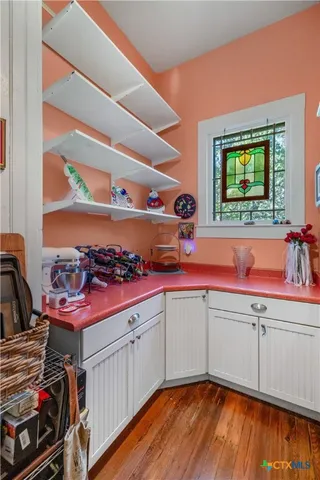 a kitchen with a stove and a sink