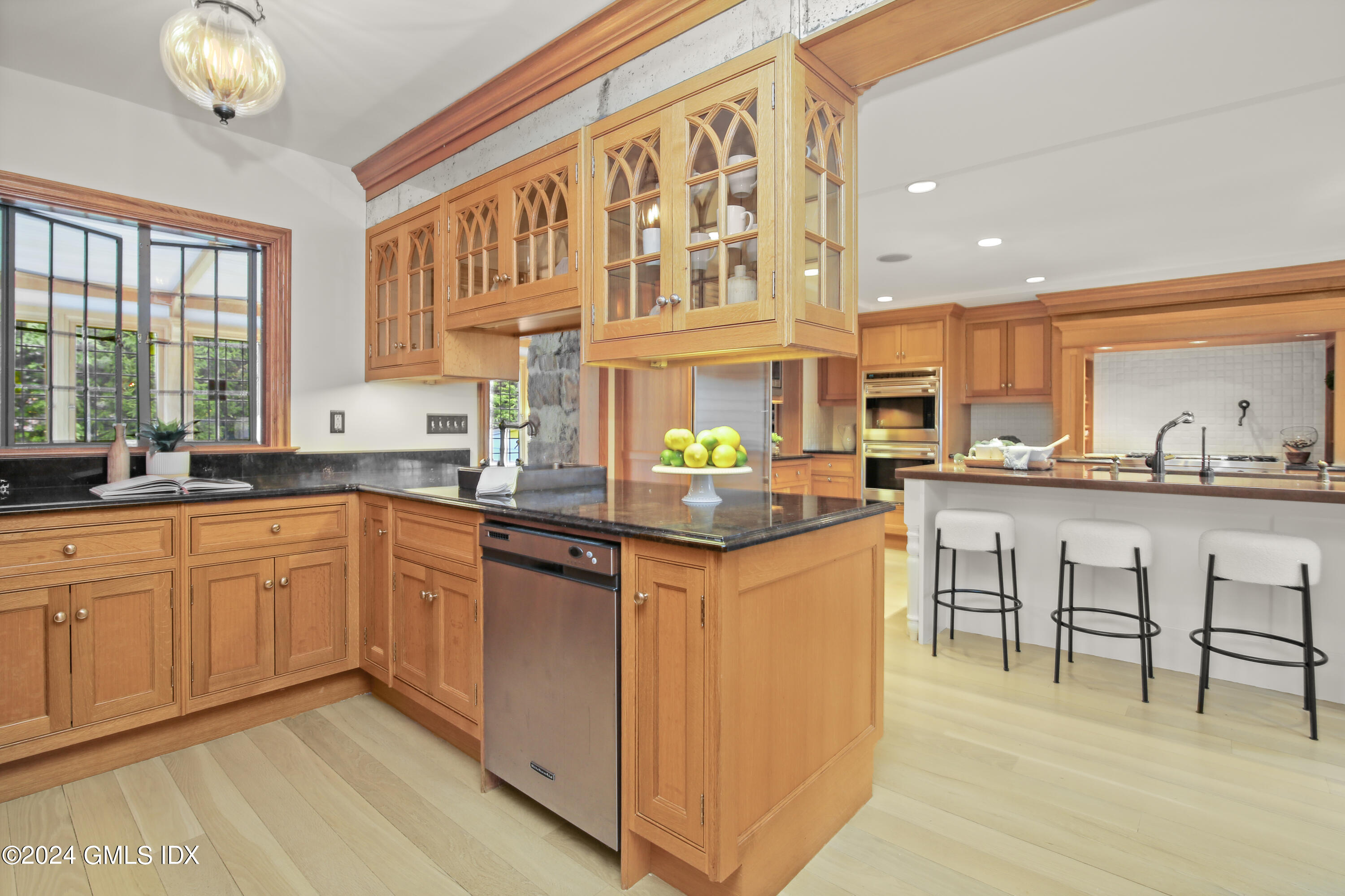 528 Field Point Road Greenwich, CT 06830 - Photo 12 of 31 a kitchen with stainless steel appliances granite countertop a sink and cabinets
