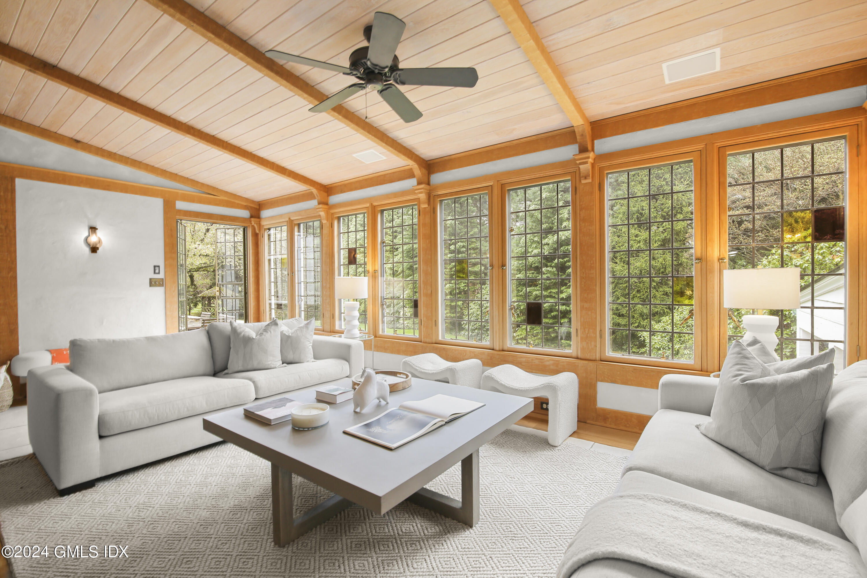 528 Field Point Road Greenwich, CT 06830 - Photo 13 of 31 a living room with furniture and a large window