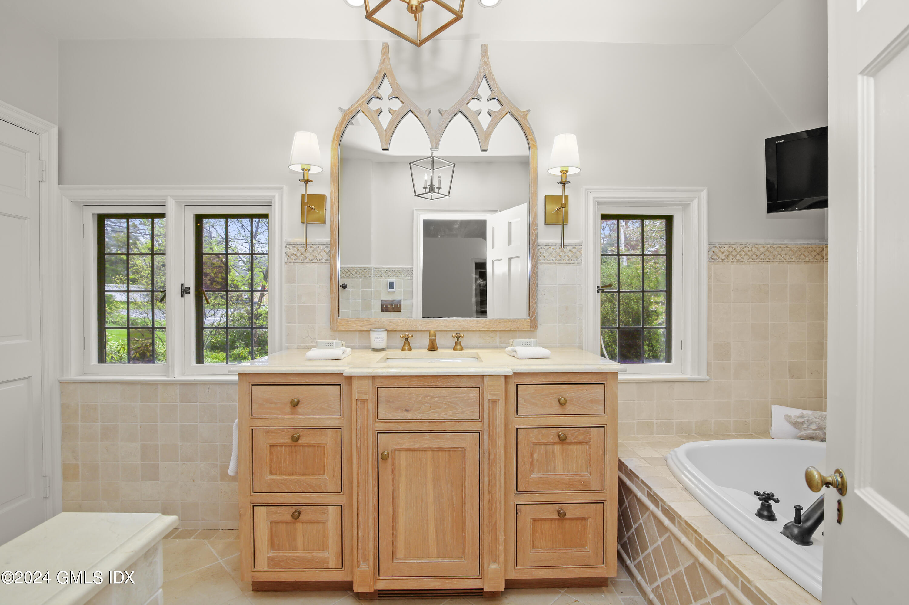 528 Field Point Road Greenwich, CT 06830 - Photo 15 of 31 a bathroom with a sink a vanity and a mirror