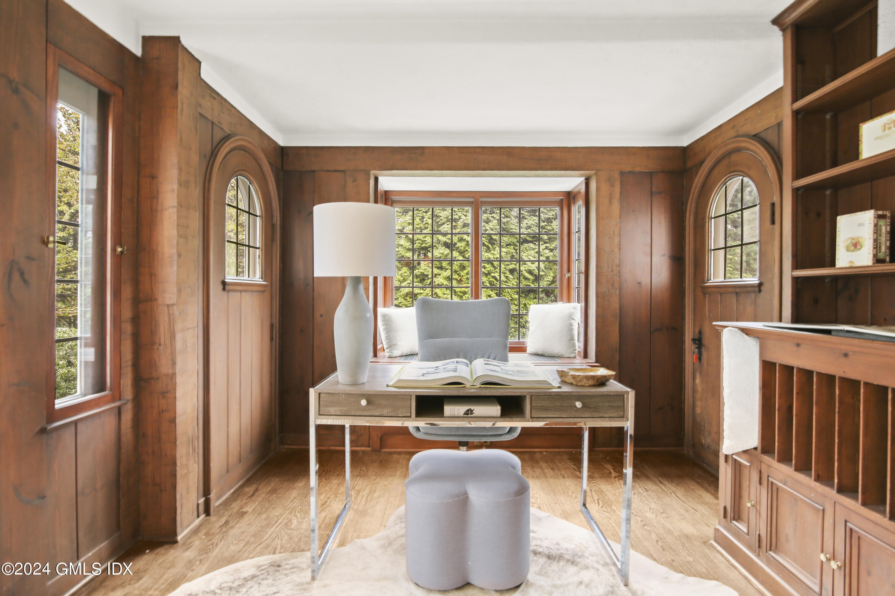 528 Field Point Road Greenwich, CT 06830 - Photo 9 of 31 a room with furniture a window and a potted plant