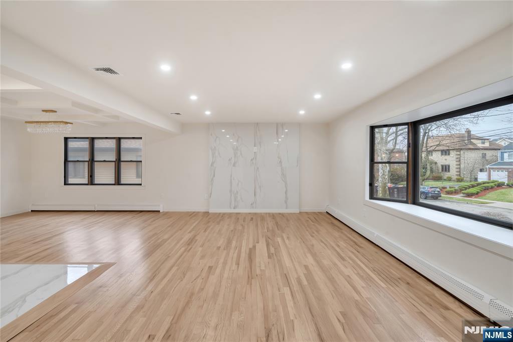 468 Morse Avenue Ridgefield, NJ 07657 - Photo 2 of 48 wooden floor in an empty room with a window