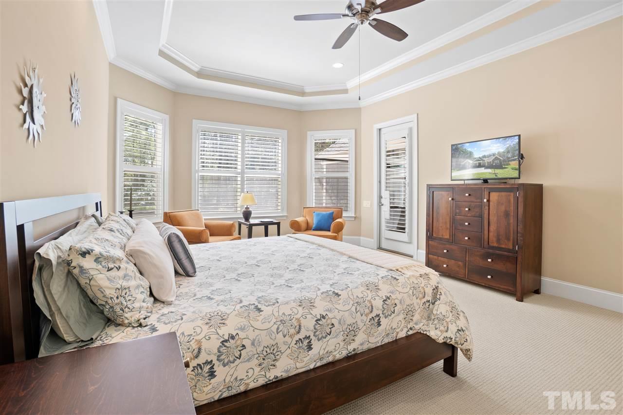 1504 Brassfield Road Raleigh, NC 27614 - Photo 13 of 30 a bedroom with a bed and a dresser