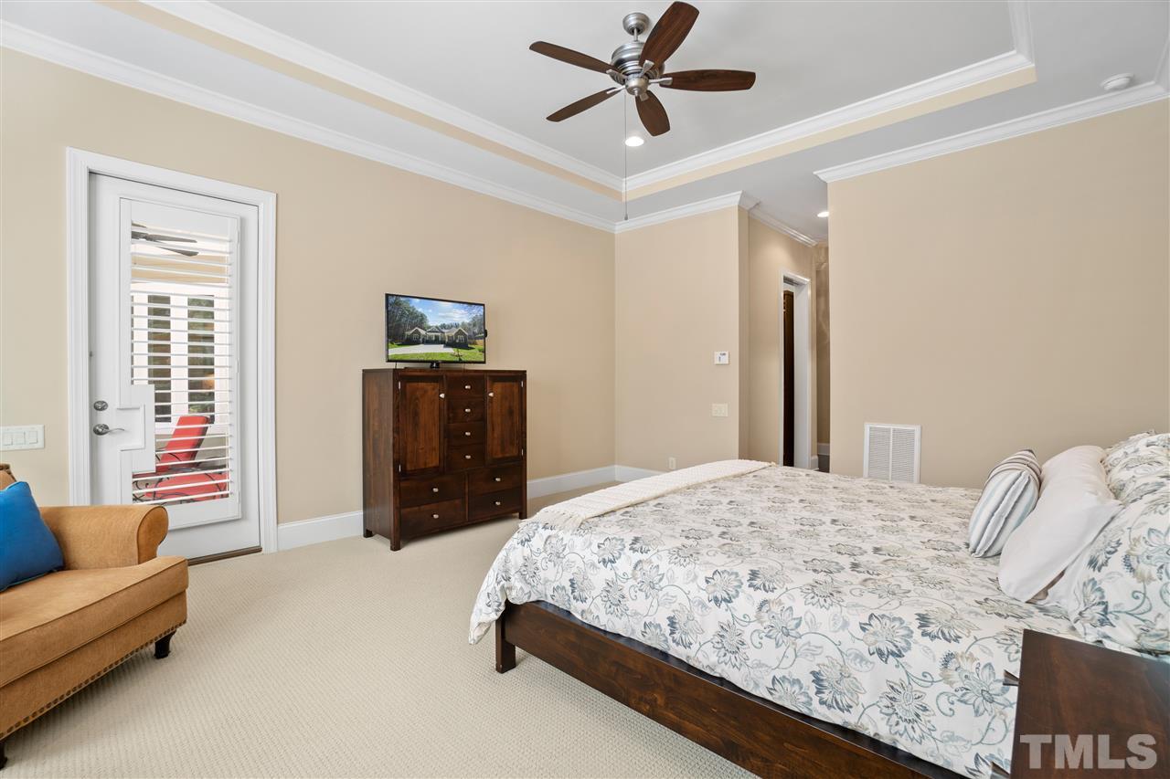 1504 Brassfield Road Raleigh, NC 27614 - Photo 14 of 30 a bedroom with a bed and a couch