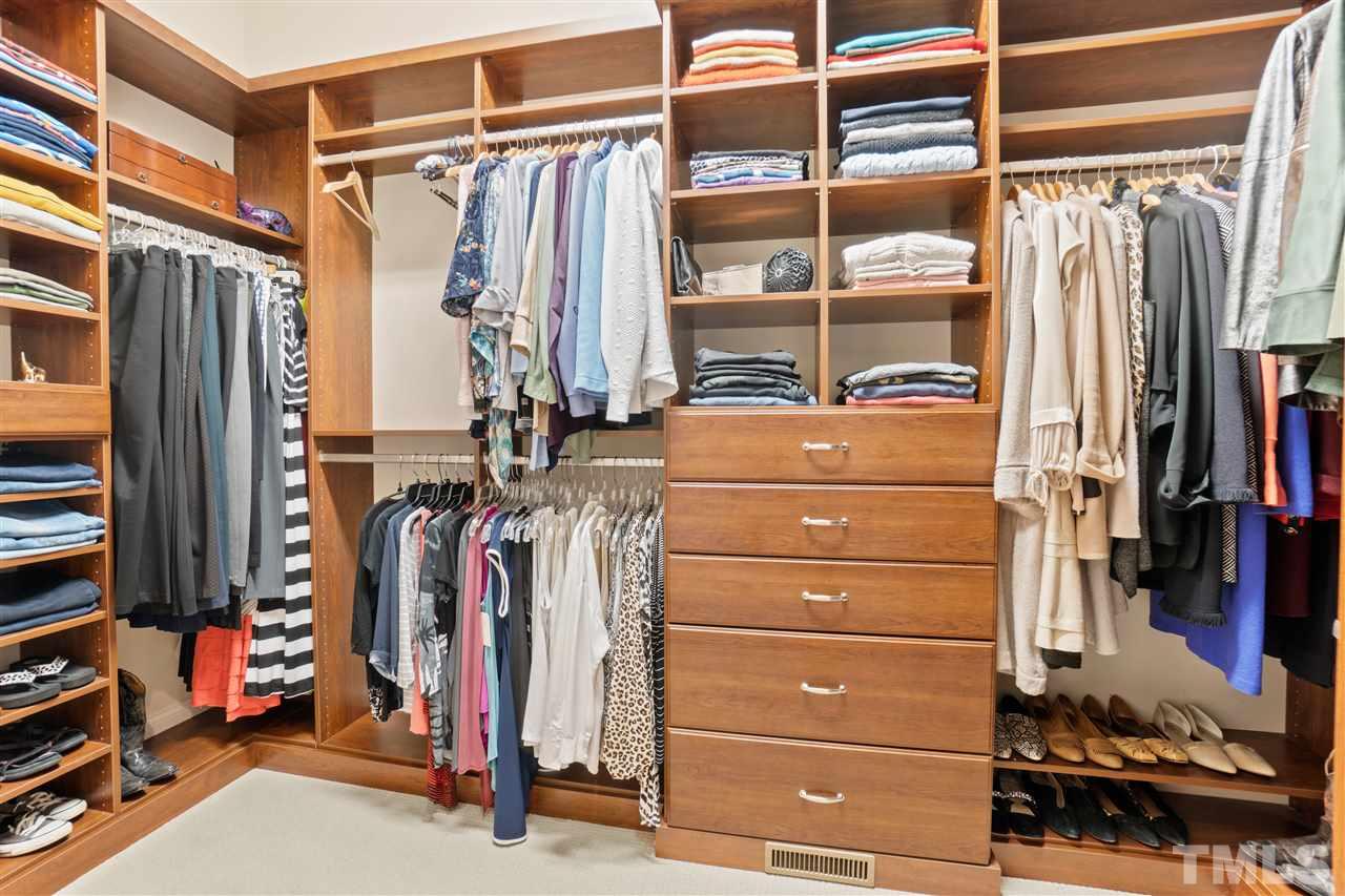 1504 Brassfield Road Raleigh, NC 27614 - Photo 15 of 30 a view of walk in closet with clothes and shoes