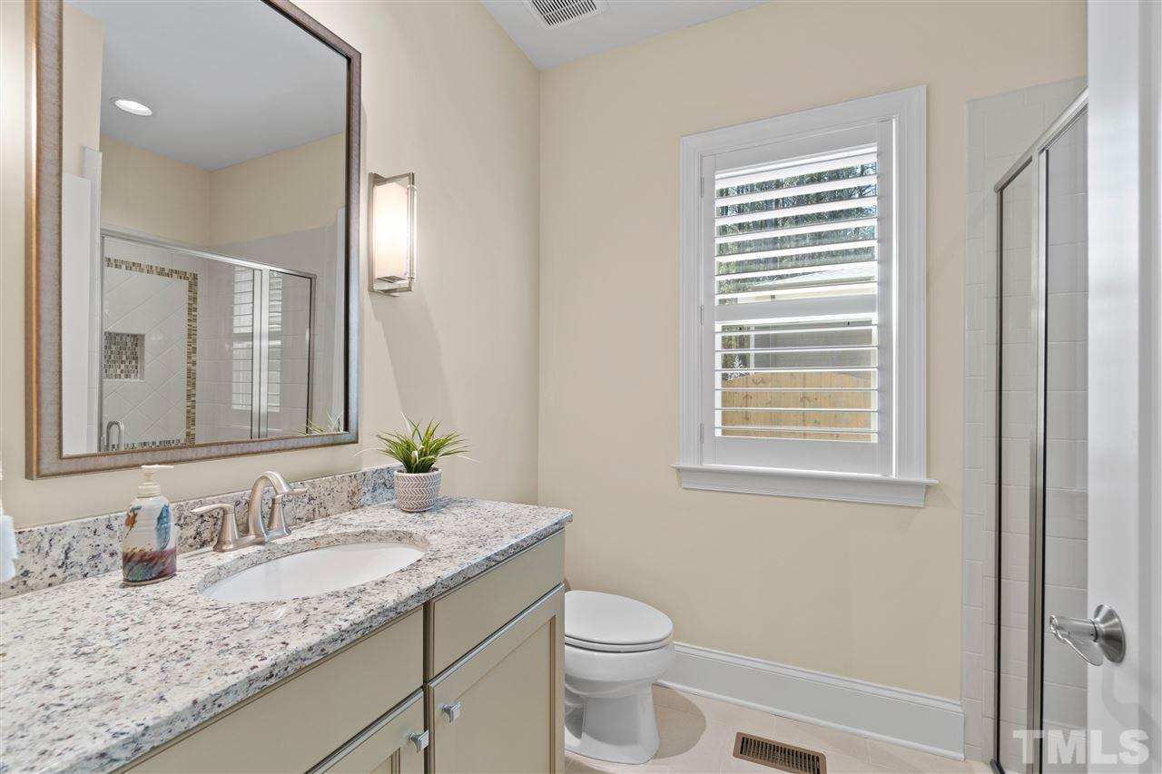 1504 Brassfield Road Raleigh, NC 27614 - Photo 23 of 30 a bathroom with a granite countertop sink toilet and mirror