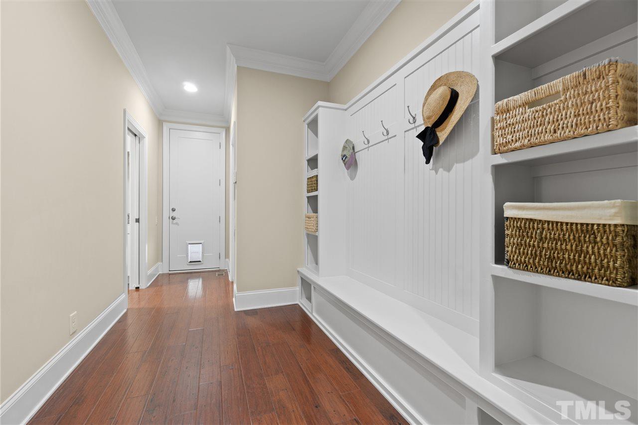 1504 Brassfield Road Raleigh, NC 27614 - Photo 24 of 30 a view of a hallway with wooden floor and staircase