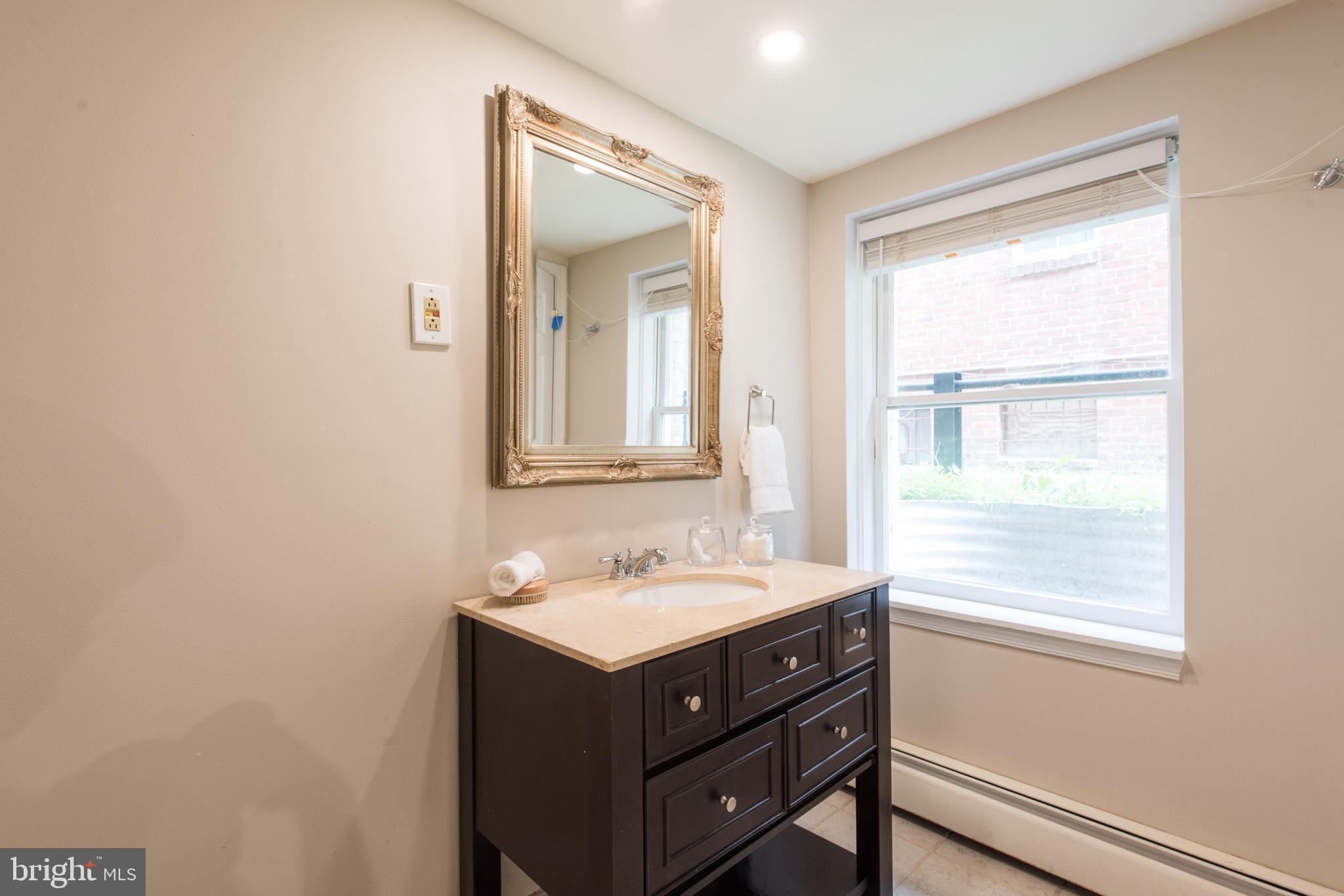 1828 Riggs Place Northwest, Unit 6 Washington, DC 20009 - Photo 18 of 23 Bathroom with separated shower room