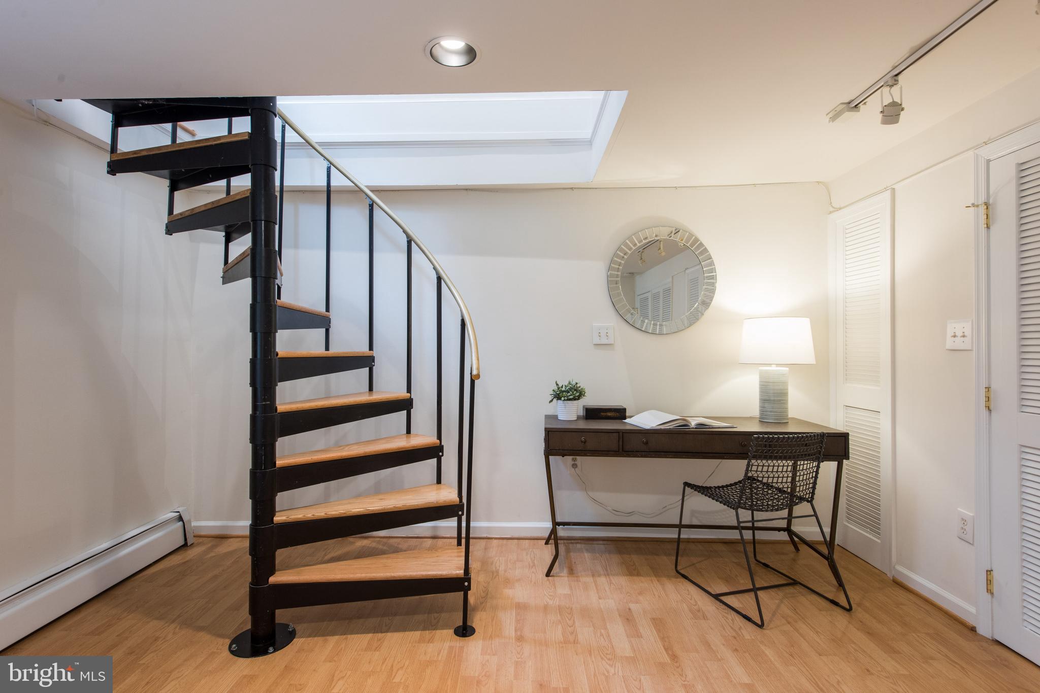 1828 Riggs Place Northwest, Unit 6 Washington, DC 20009 - Photo 10 of 23 Spiral staircase to lower level