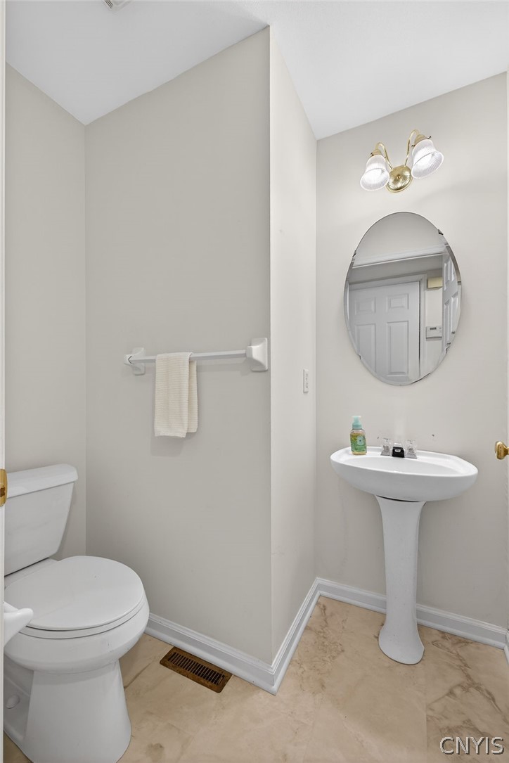 4848 Yenny Road Onondaga, NY 13215 - Photo 9 of 50 First floor half bath with new flooring and new to