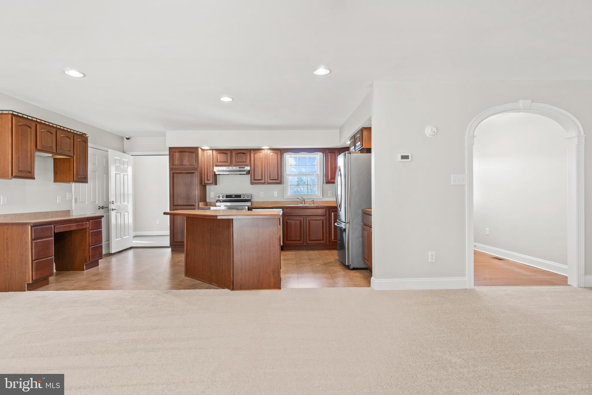 8589 River Road Lancaster, VA 22503 - Photo 8 of 49 a large white kitchen with a cabinetry and kitchen view