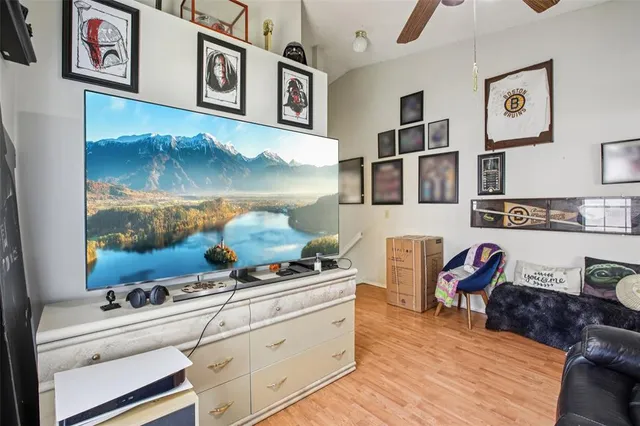 a kitchen with stainless steel appliances granite countertop a stove and a wooden floor