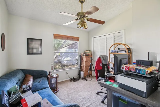 a view of a workspace with furniture and toys