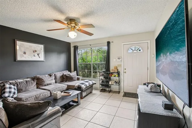 a living room with furniture and a large window