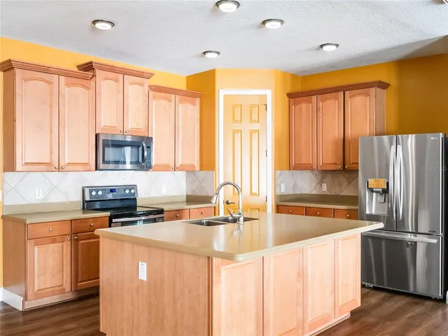a spacious bathroom with a double vanity sink and a mirror
