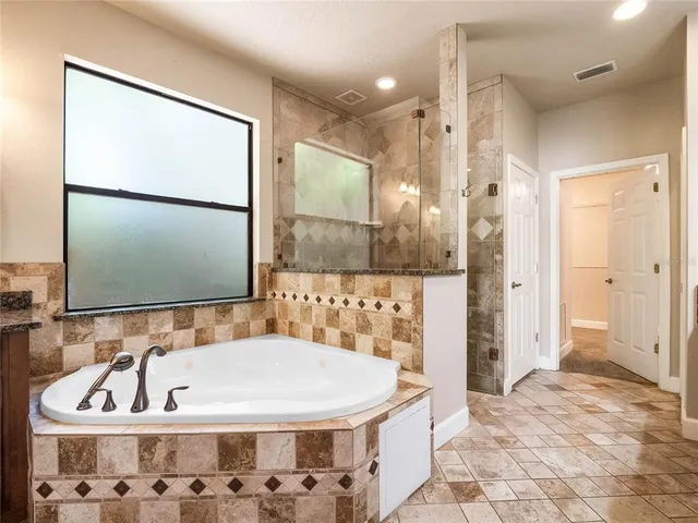 a bathroom with a sink a toilet and a bathtub