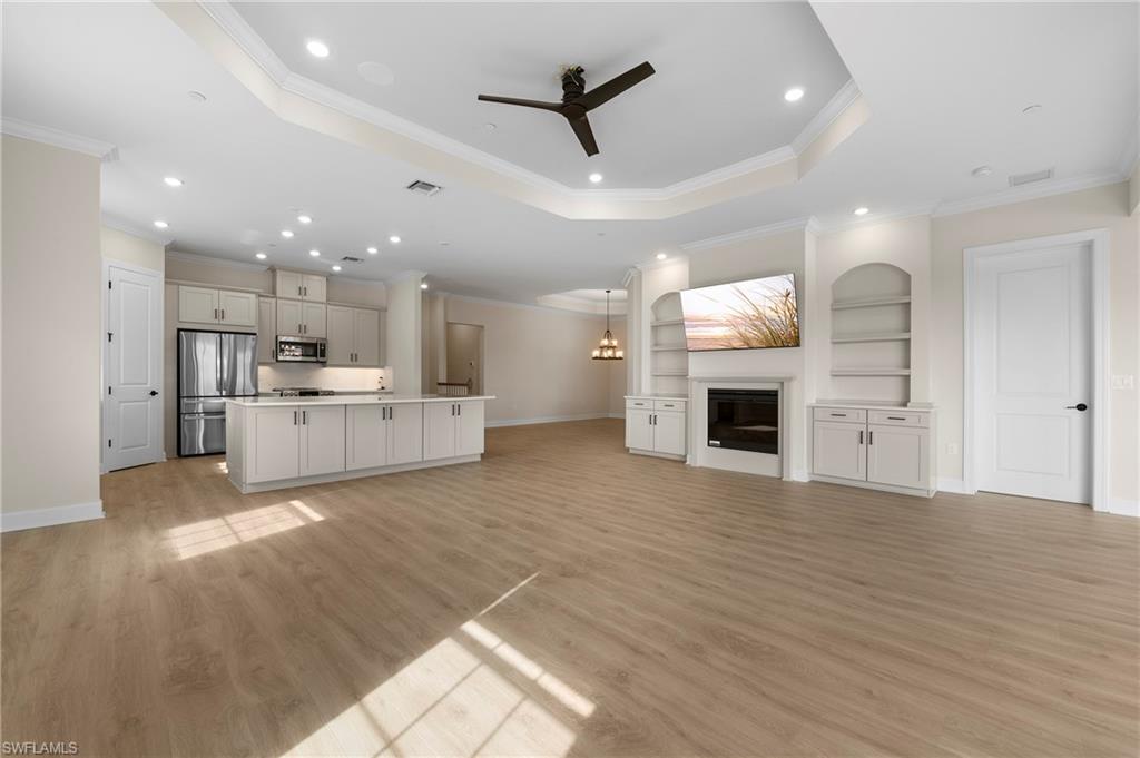a view of a kitchen with a stove cabinets and wooden floor