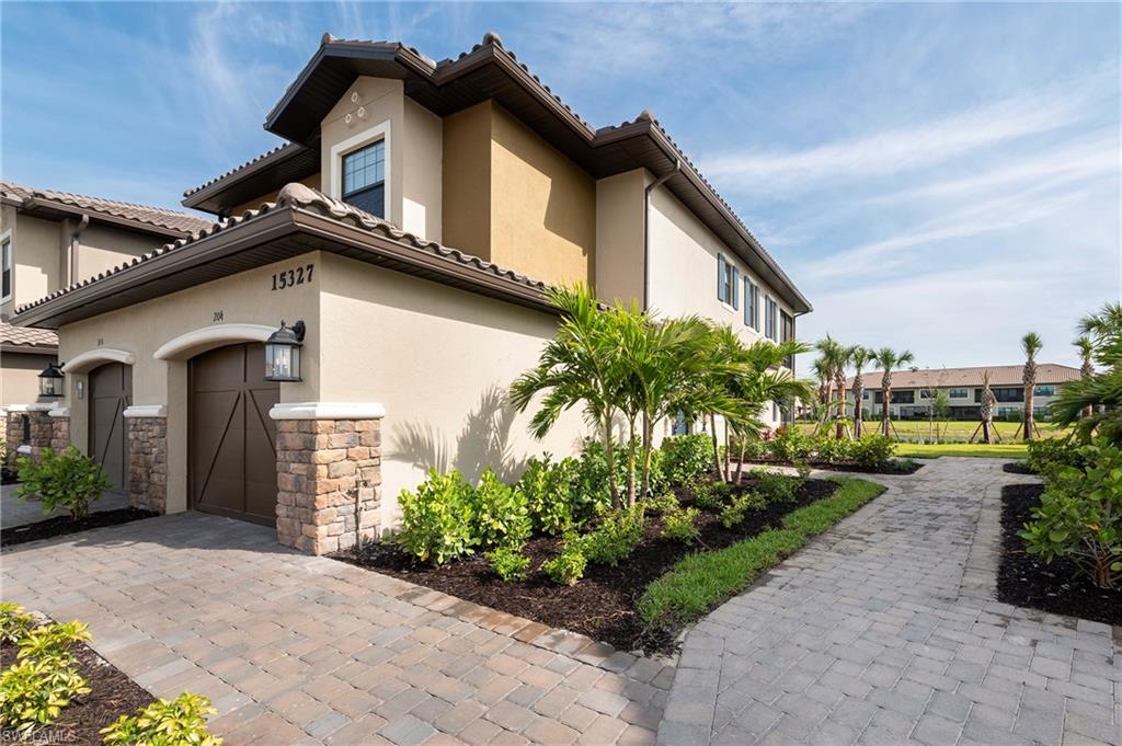 15327 Lucerna Street, Unit 204 Naples, FL 34114 - Photo 11 of 45 a house view with a outdoor space
