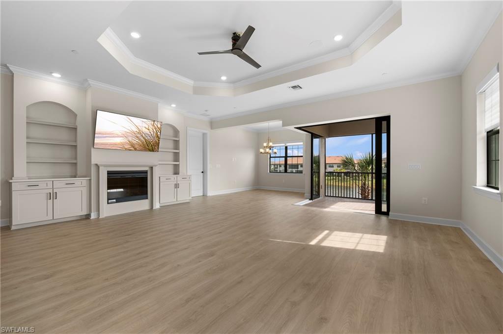 15327 Lucerna Street, Unit 204 Naples, FL 34114 - Photo 20 of 45 a view of an empty room with window and fire place