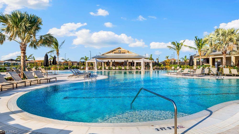 15327 Lucerna Street, Unit 204 Naples, FL 34114 - Photo 42 of 45 a view of a swimming pool with outdoor seating