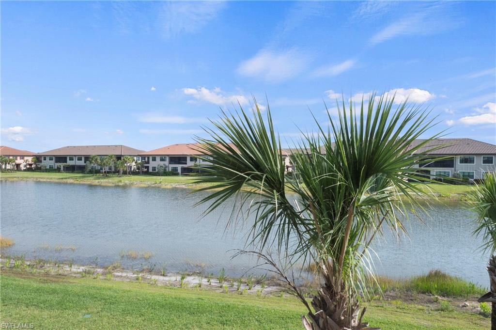 15327 Lucerna Street, Unit 204 Naples, FL 34114 - Photo 6 of 45 a view of a swimming pool and a yard