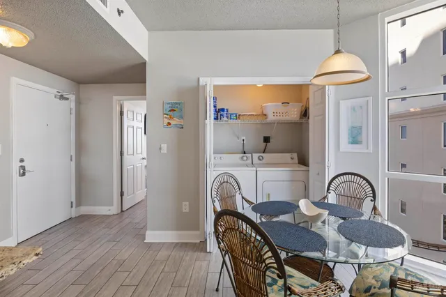 a bedroom with a bed and painting on the wall