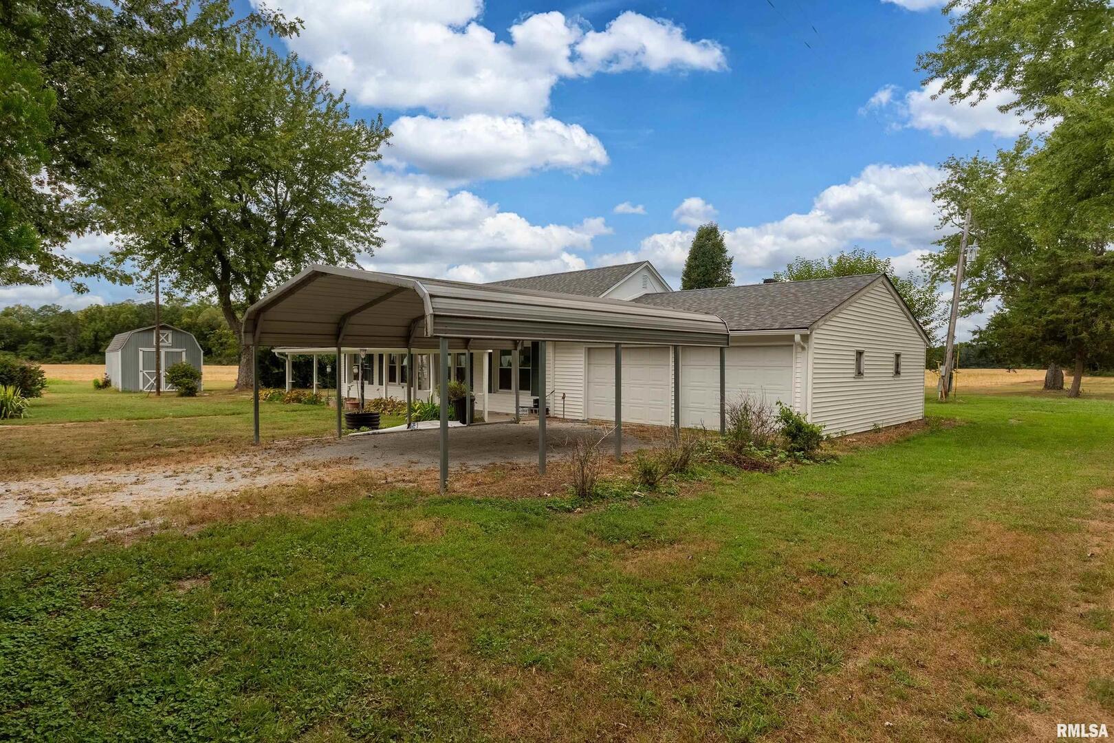 53 Private Road De Soto, IL 62924 - Photo 13 of 36 a front view of a house with garden