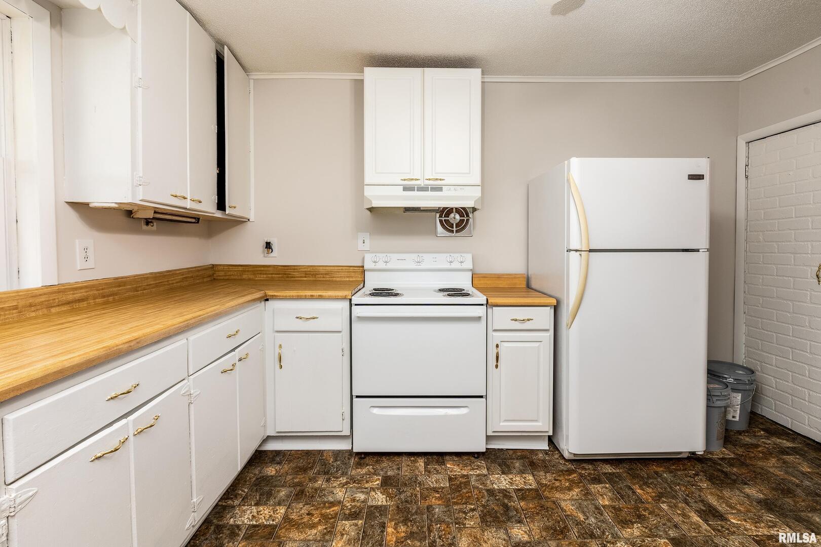 53 Private Road De Soto, IL 62924 - Photo 20 of 36 a white refrigerator freezer sitting inside of a kitchen