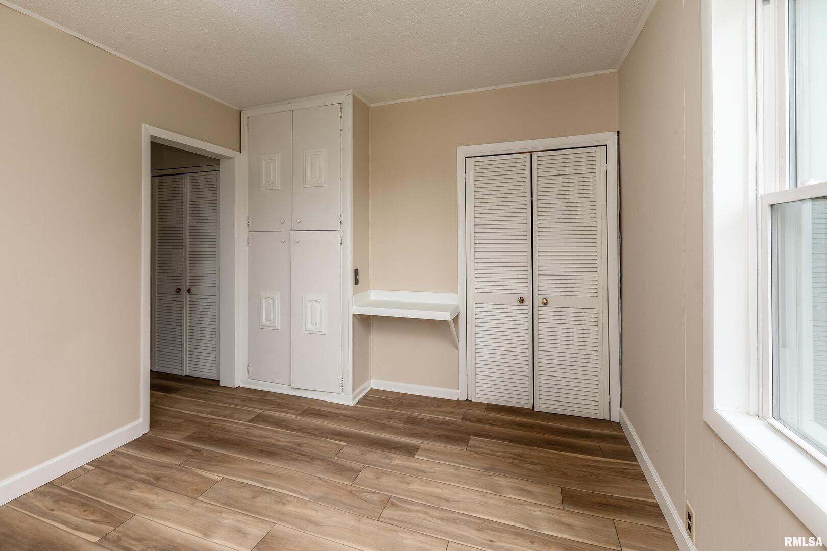 53 Private Road De Soto, IL 62924 - Photo 27 of 36 a view of an empty room with wooden floor and window