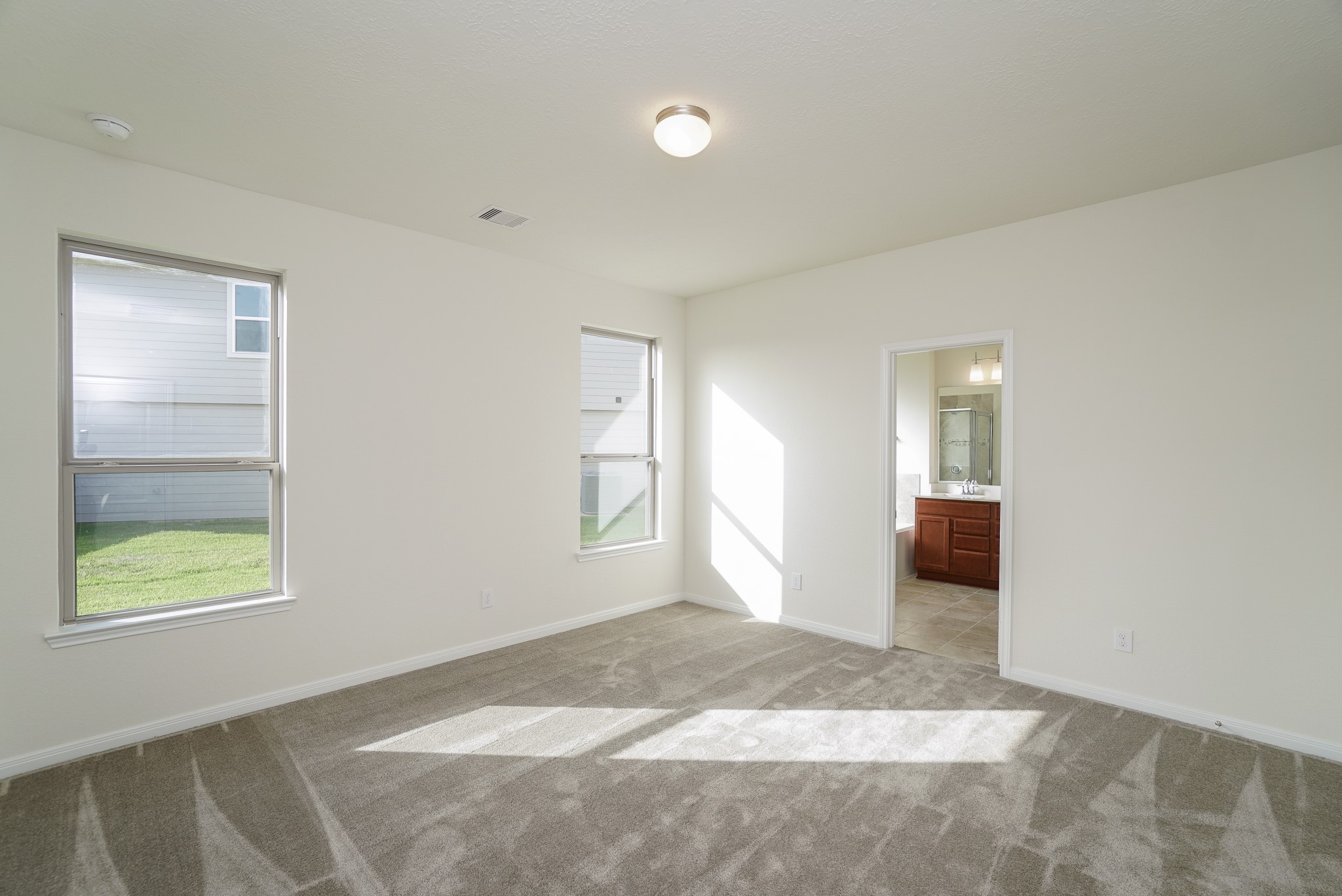 4822 Westfield Ranch Court Katy, TX 77449 - Photo 19 of 48 an empty room with windows and closet