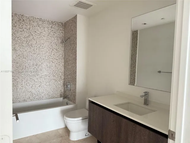 a lobby with furniture and a window